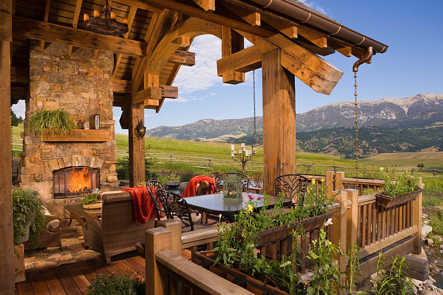 Stone fireplace and a cozy sitting area for the rustic deck