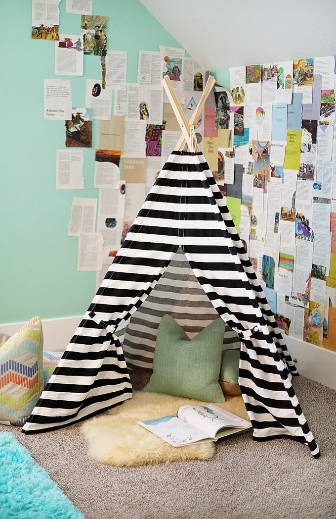 Striped teepee as a reading nook in a corner of the room