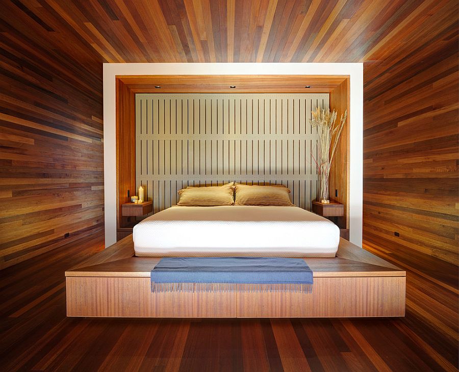 Stunning mahogany-lined master bedroom with platform bed