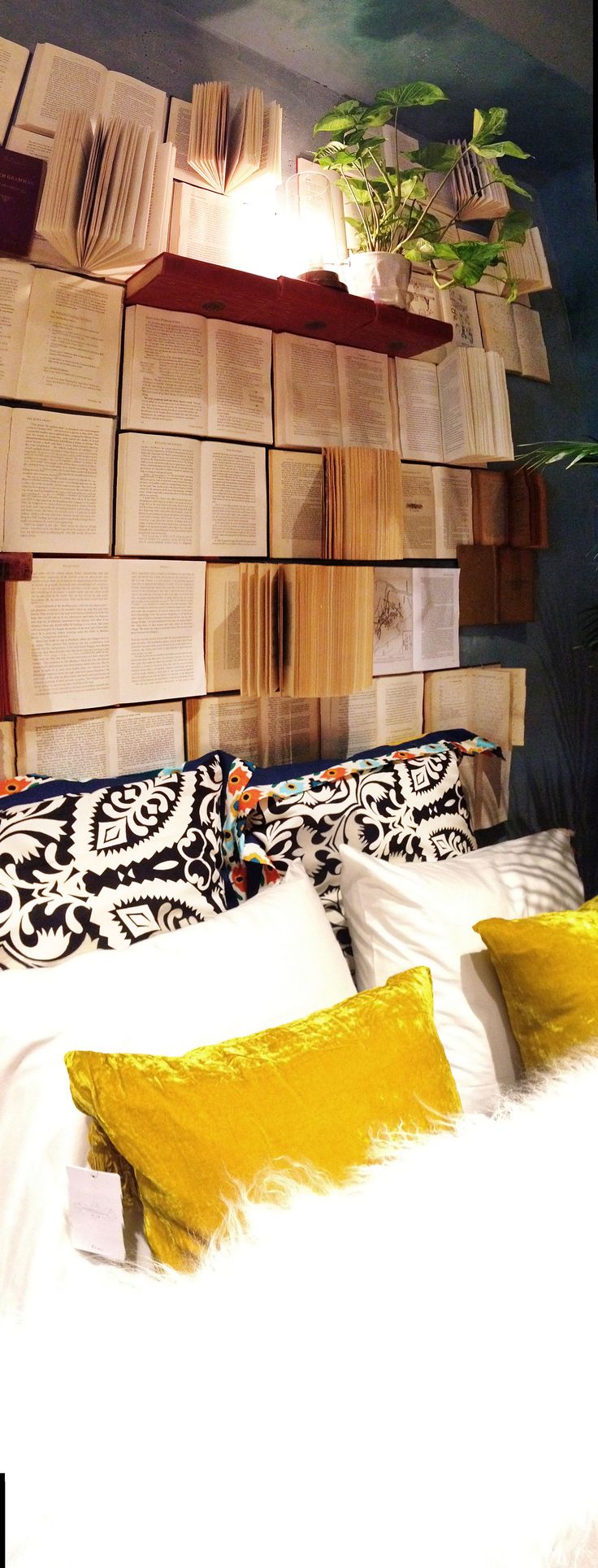 Super creative headboard made of actual books