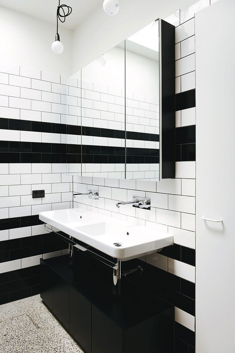 Tiny black and white bathroom with shower area