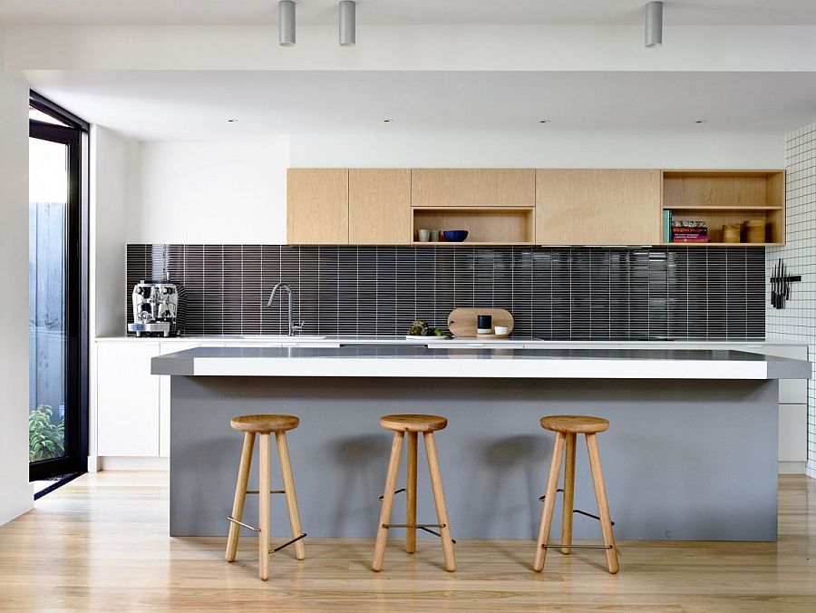 Upper kitchen cabinet and bar stools add warmth of wood to the modern kitchen