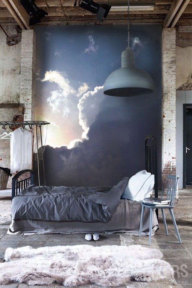 Urban bedroom with a cloud mural