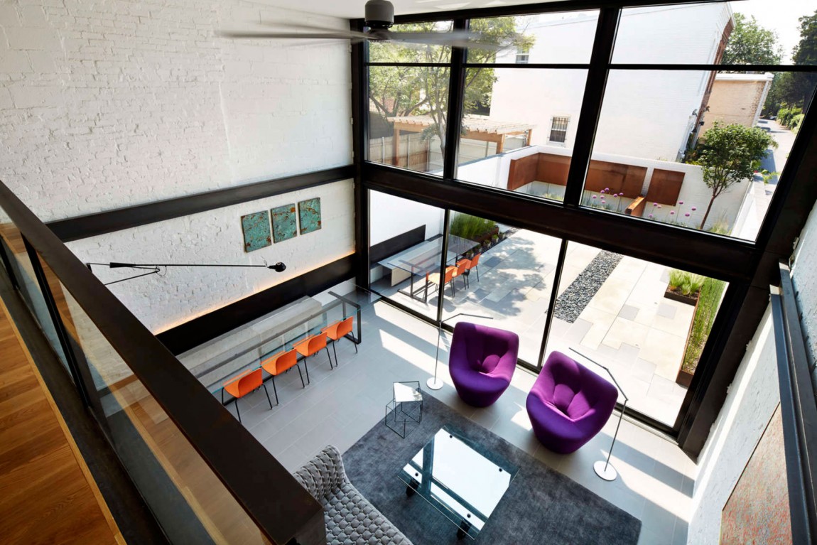 View of the lower level living area from the mezzanine lounge