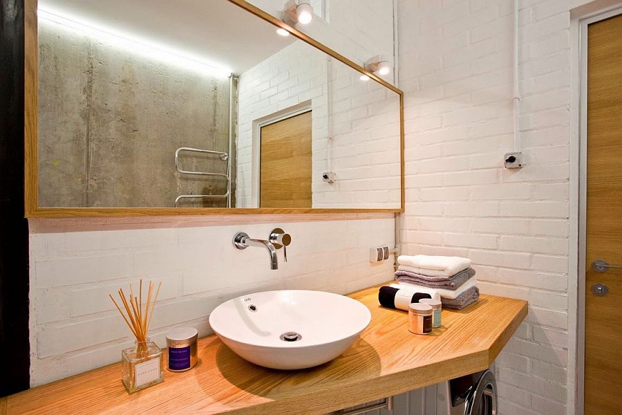 White brick walls give the bathroom a vintage appeal