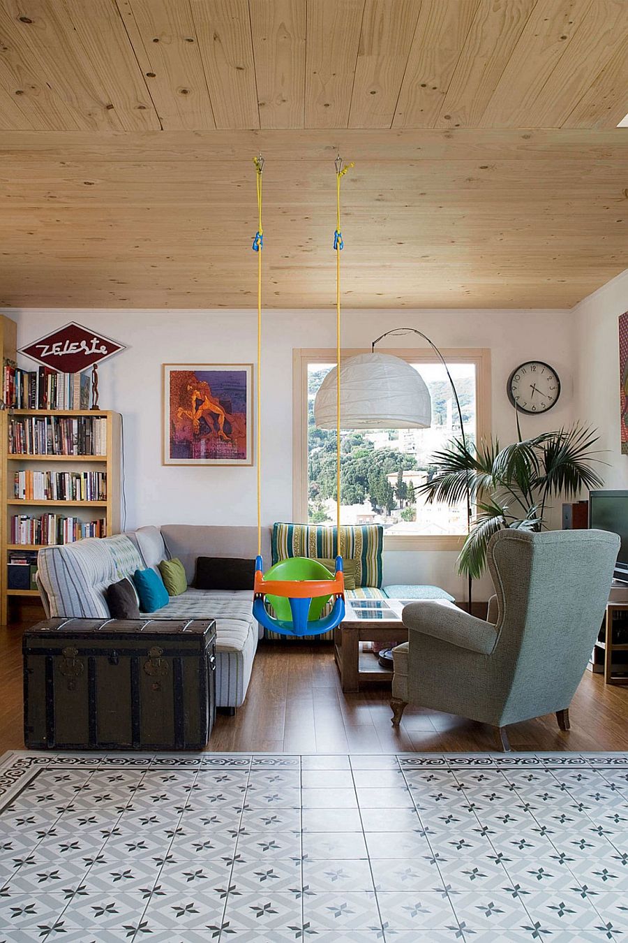 Wooden ceiling and vintage trunk add personality to the interior