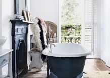 A-fireplace-and-matching-clawfoot-tub-in-a-bathroom-with-a-balcony-217x155