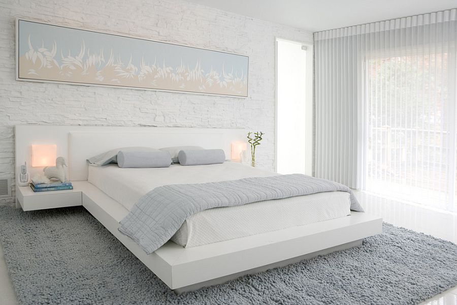 A perfect bedroom for those who love brick walls and loads of white! [Design: Habachy Designs]