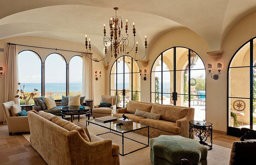 Arched windows and limestone-inspired paint give the living room a modern Mediterranean style