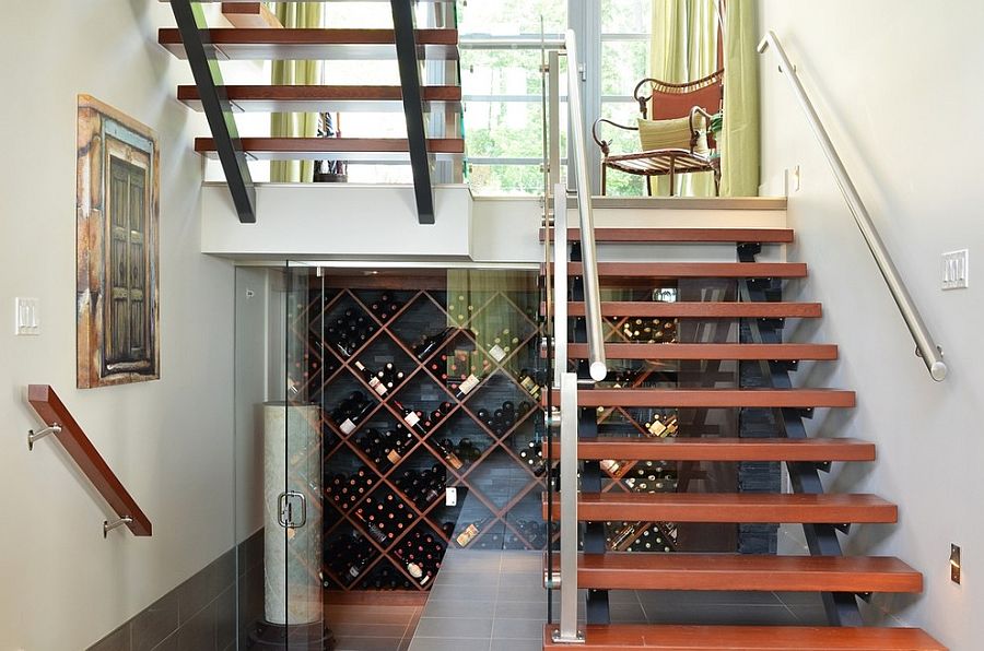 Awesome contemporary wine cellar under the sleek staircase