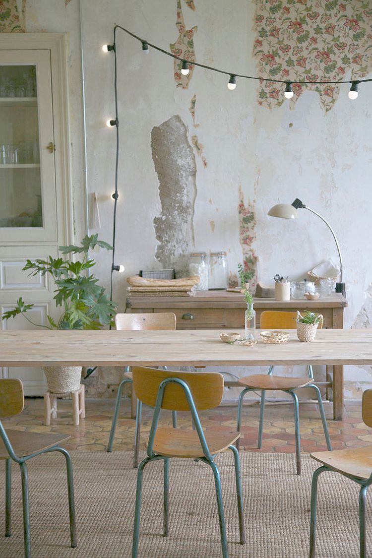 Backdrop and string lighting create the image of a casual, cozy dining room