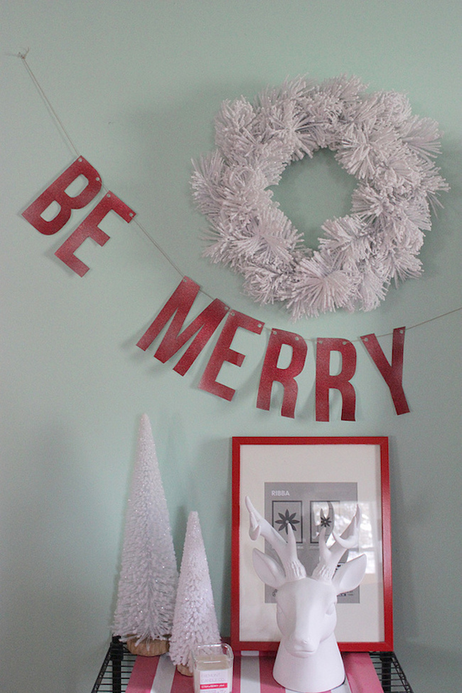 Be Merry holiday banner on the wall