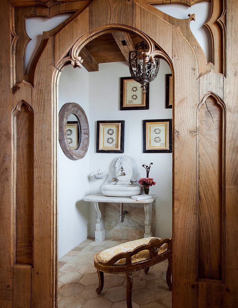 Beautiful powder room with custom fittings and mirror that captures the Mediterranean style perfectly