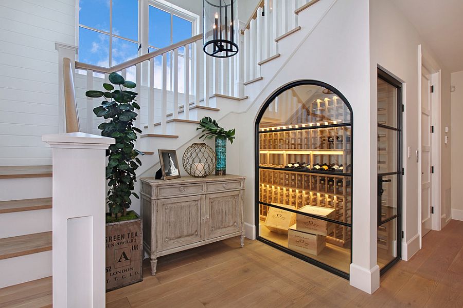 Beautiful temperature controlled wine room under the stairs [Design: Brandon Architects]