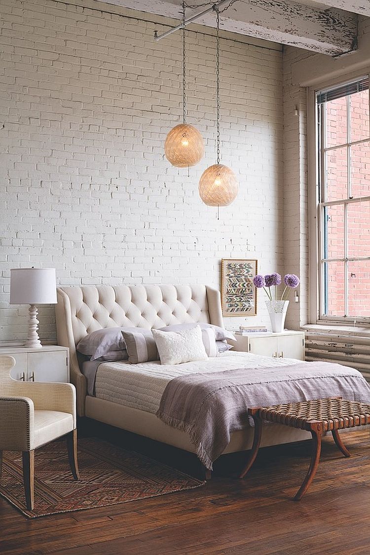 Bedding, lighting, rug and subtle details give this bedroom an air of femininity