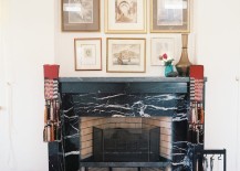 Black-marble-fireplace-under-a-wall-art-display-217x155