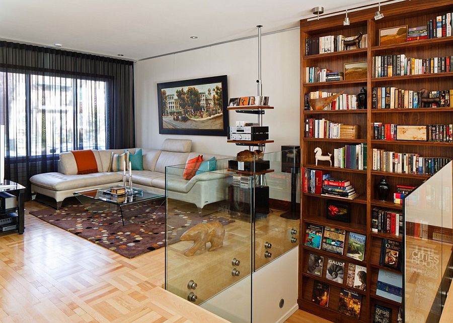 Black sheer curtain, large bookshelf and comfy sectional inside the Montreal home