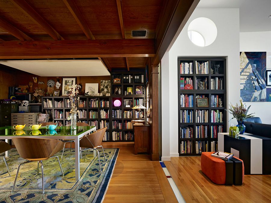 Bookshelves act as a common design element in the living room and dining room