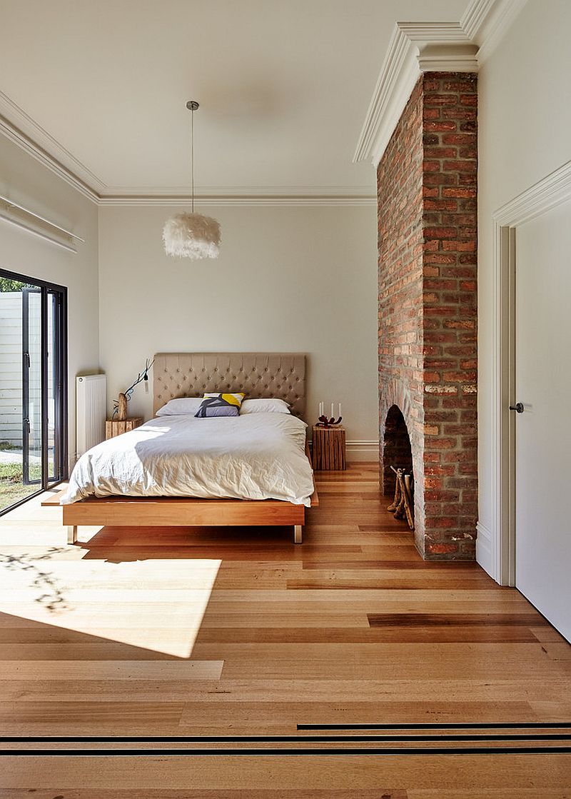 Brick fireplace brings traditional charm to the contemporary bedroom [Design: Andrew Maynard Architects]