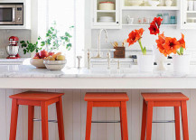Bright-orange-bar-stools-and-accents-in-a-white-kitchen-217x155