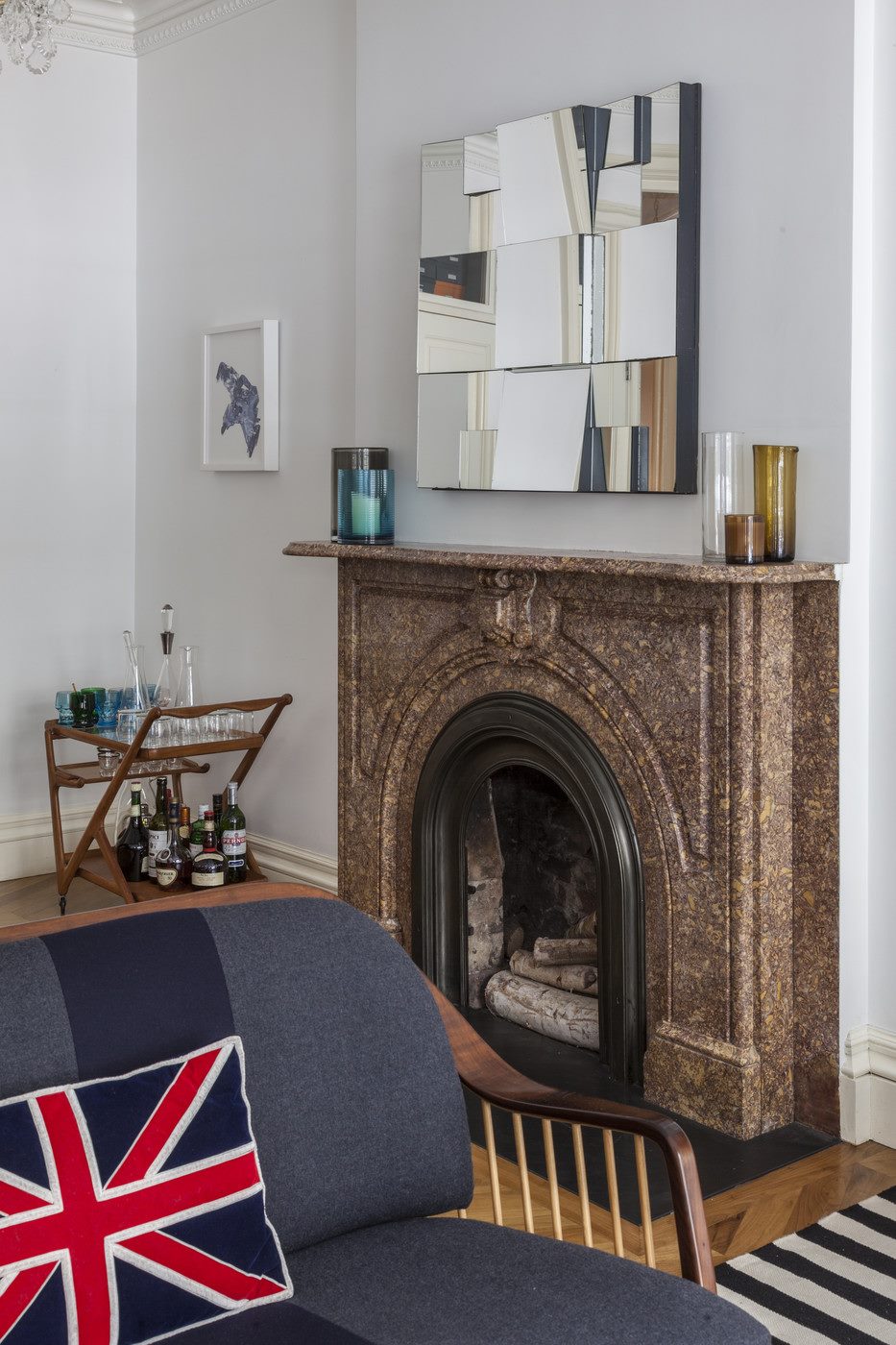 Brown marble fireplace in an eclectic space