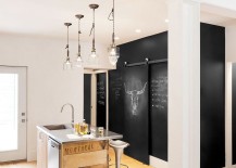 Chalkboard-wall-in-the-kitchen-along-with-a-tiny-island-clad-in-reclaimed-wood-217x155