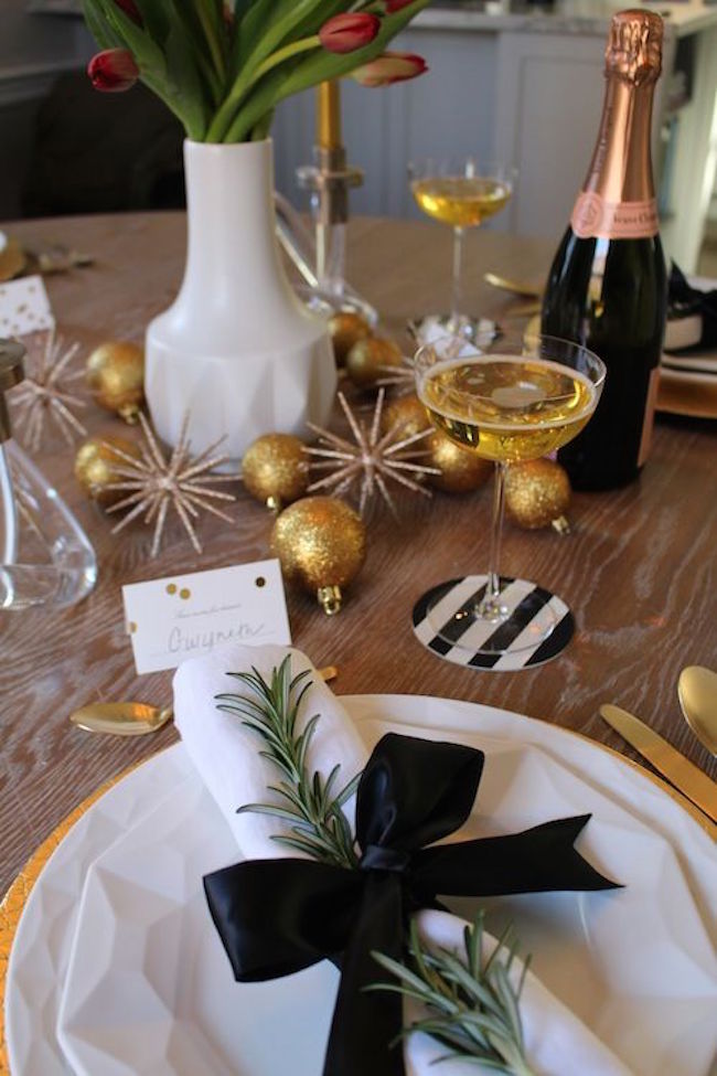 Chic holiday tablescape in gold, black, and white