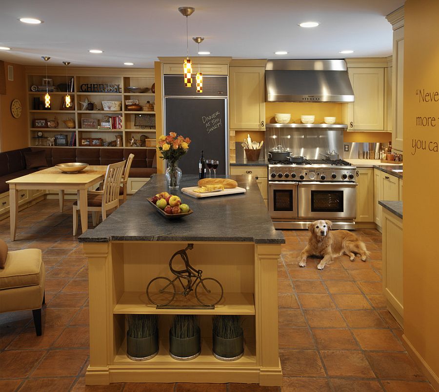 Classic Mediterranean style kitchen with warm yellows and terracotta floor tiles [Design: Caden Design Group]