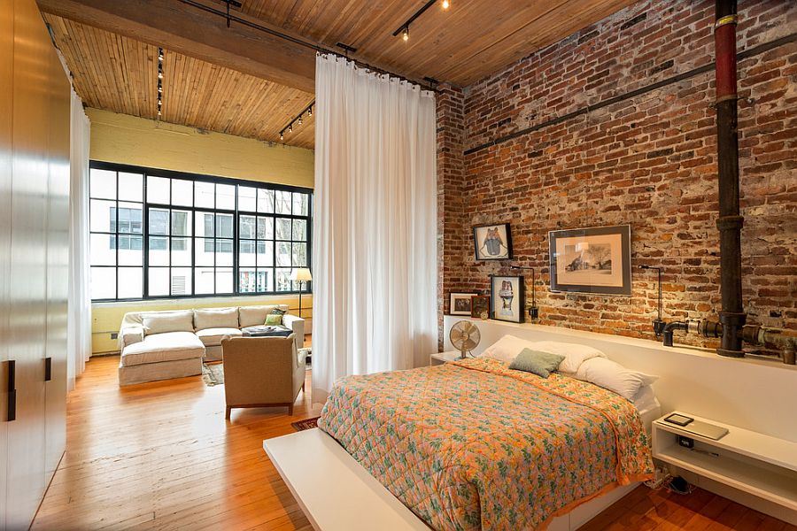 Contemporary and industrial elements come together elegantly in this spacious bedroom [Design: Crescent Builds]