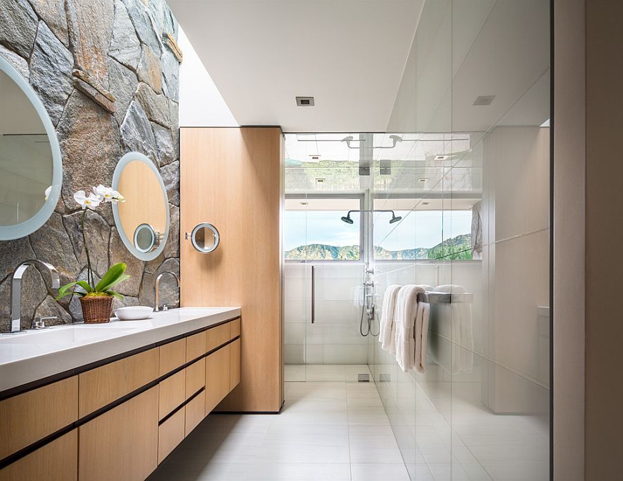 Contemporary bathroom combines glass tile with the classic stone wall [Design: studio bracket]