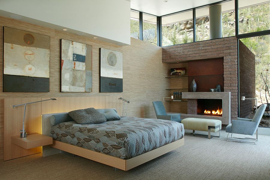 Contemporary bedroom with cozy fireplace and corner shelving