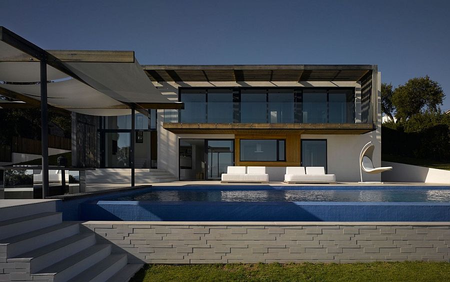 Contemporary pool area and deck of the lavish French Villa