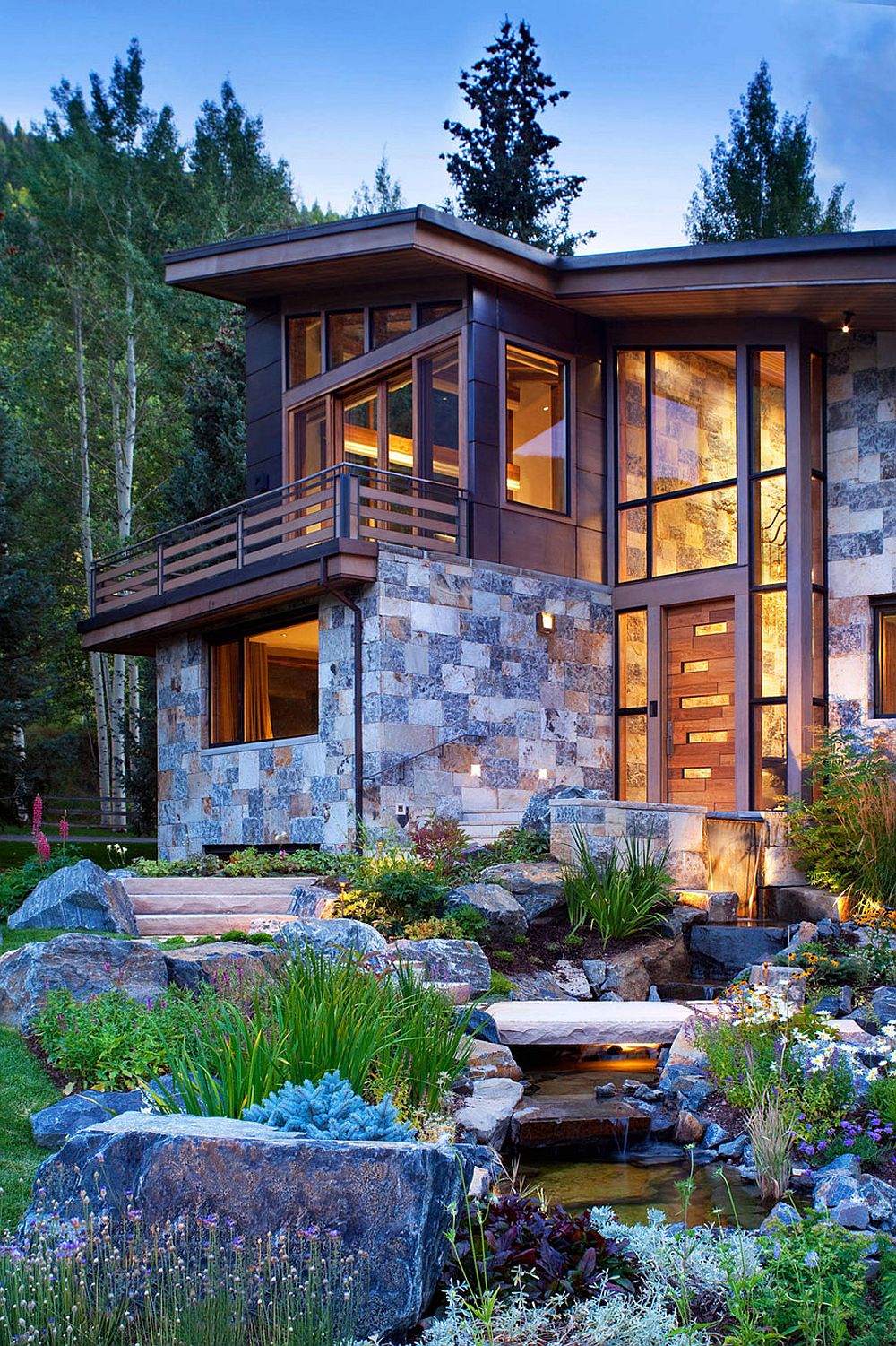 Copper roof and natural dry-stack stone give the mountain home a unique presence