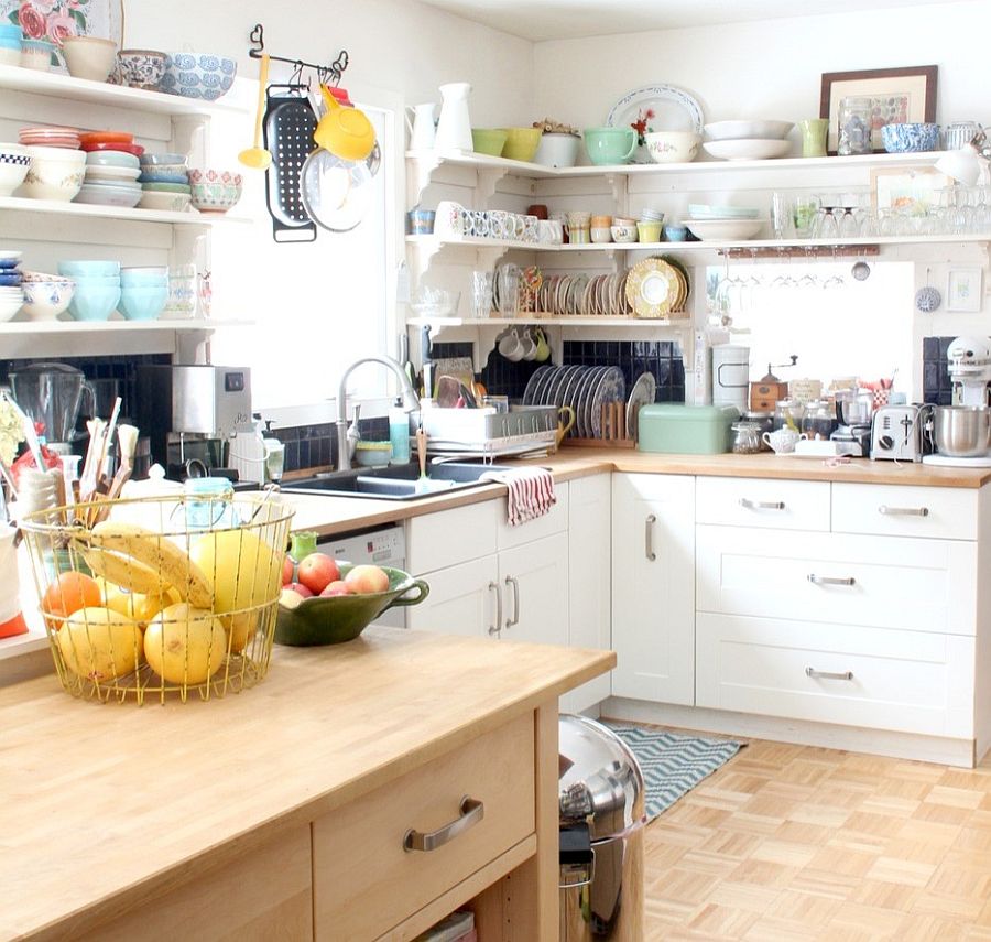 Corner shelving saves up precious space in the small kitchen [Design: Tamar Schechner - Nest Pretty Things]