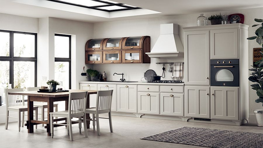 Curved wall units in the corner steal the spotlight in this kitchen