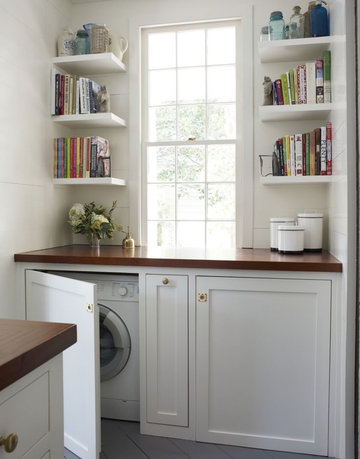 Custom cabinets with countertop to hide washer and dryer