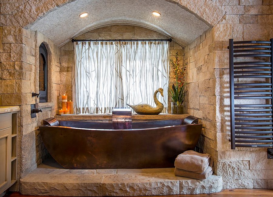 Custom copper bathtub and stone backdrop steal the show here
