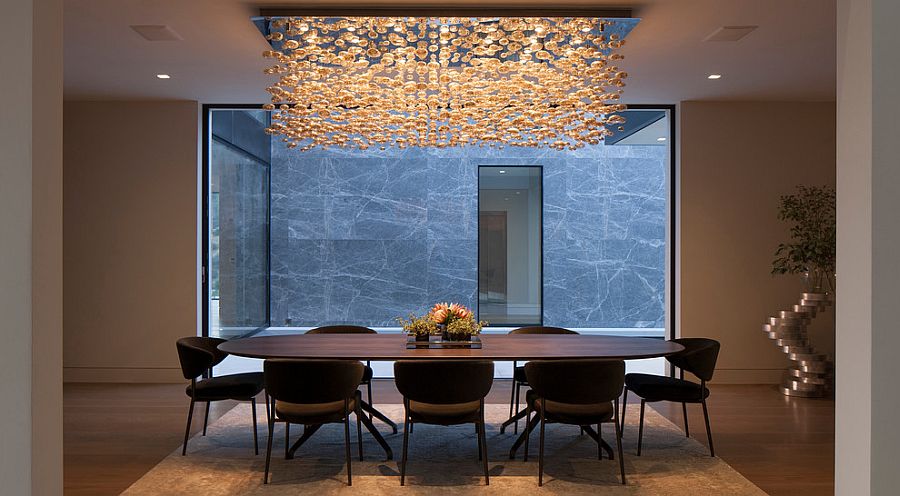 Custom-crafted cascading chandelier steals the show in this LA dining room