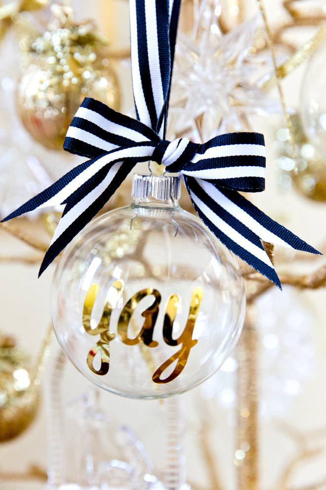 DIY personalized glass ornaments in gold with black and white ribbon