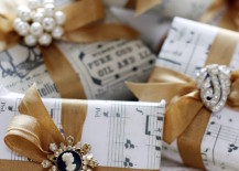DIY-wrapping-paper-using-sheet-music-gold-ribbon-and-jewelry-pieces-217x155