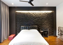 Dark-brick-wall-in-the-bedroom-highlighted-using-smart-lighting-217x155