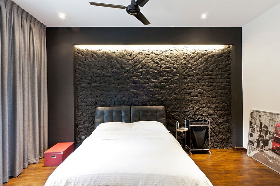 Dark brick wall in the bedroom highlighted using smart lighting [Design: Architology]