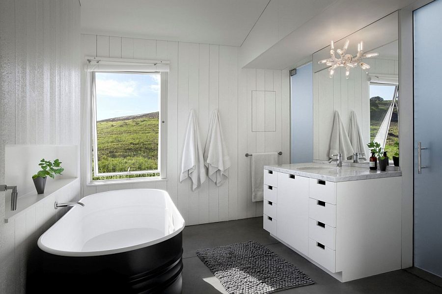 Dark classic bathtub set against a white backdrop in the bathroom