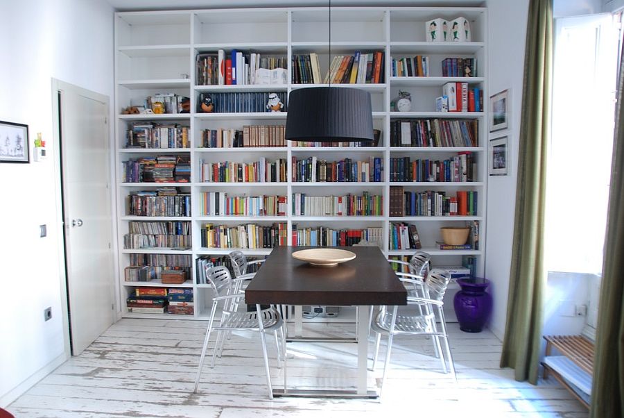 Dark, modest dining table stands in contrast with the rest of the room [Design: Isolina Mallon Interiors]