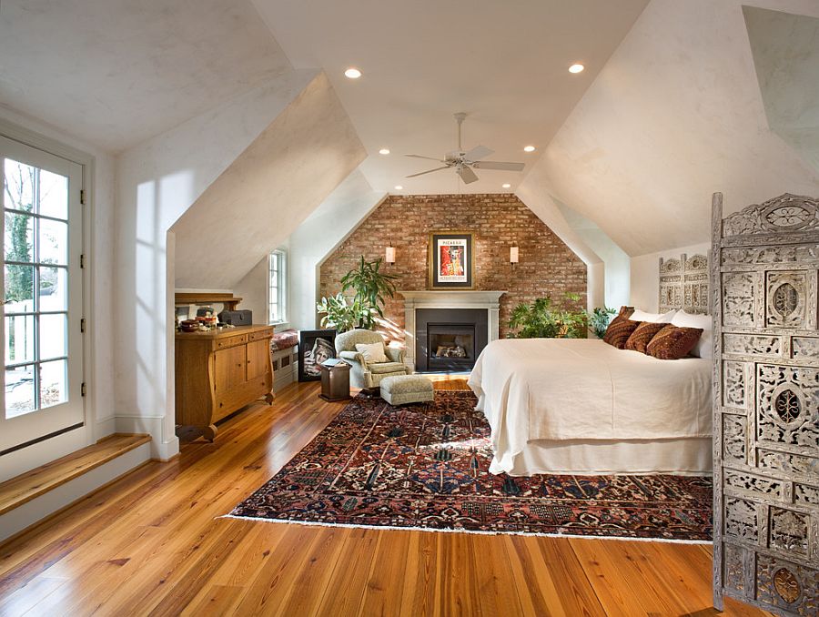 Eclectic and spacious bedroom with burnished plaster and exposed brick walls [Design: McNally Interiors]