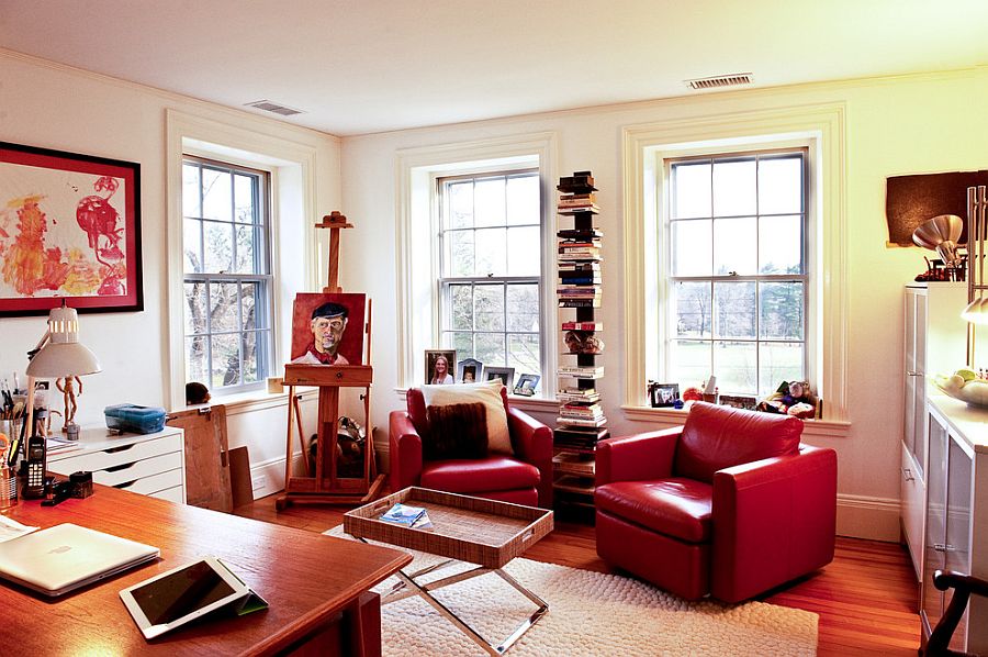 Eclectic home office uses plush leather chairs to bring in a dash of red [From: Mary Prince Photography]