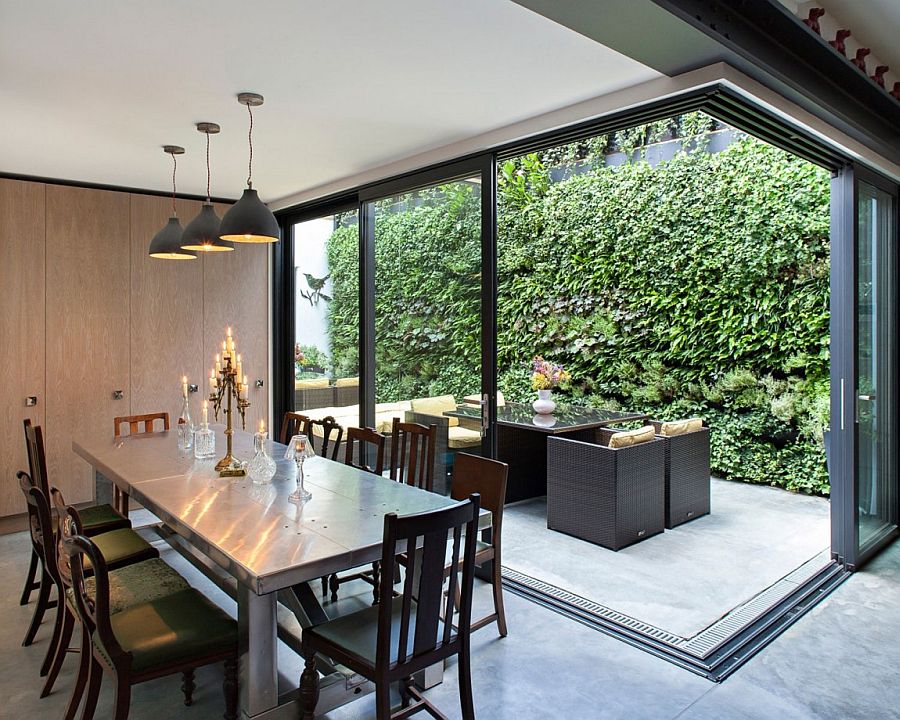 Elegant dining area with mored pendants in gray and classic dining table chairs