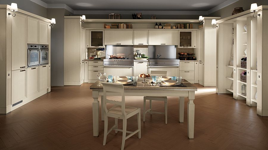 Elegant white backdrop and central dining space turn this Scavolini kitchen into an absolute dream