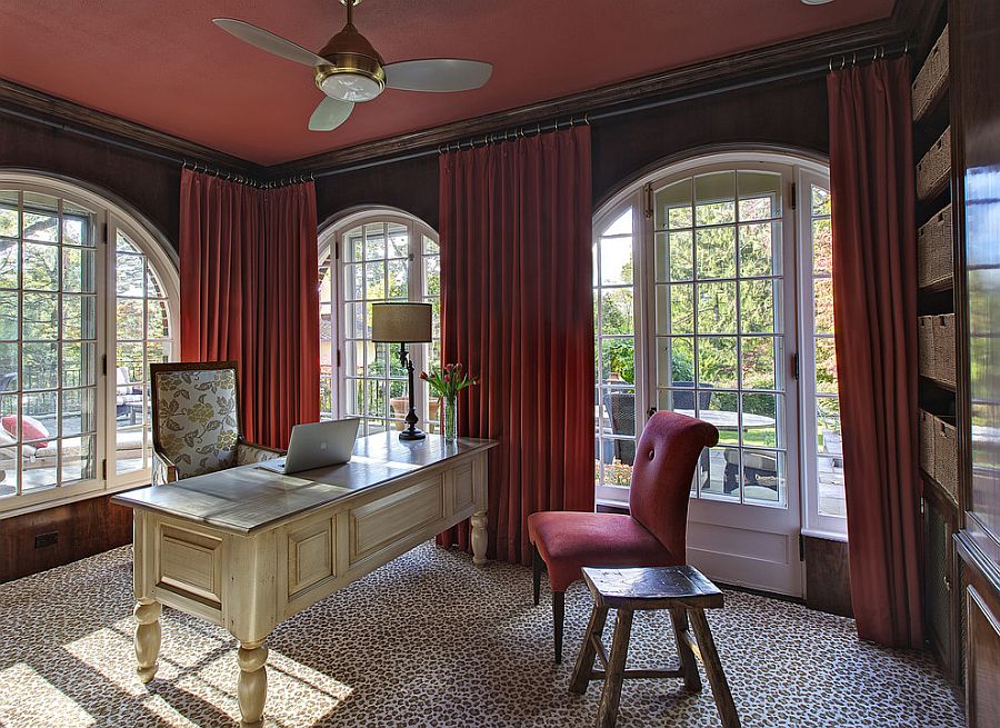 Even the ceiling and drapes embrace a bold splash of color in this home office