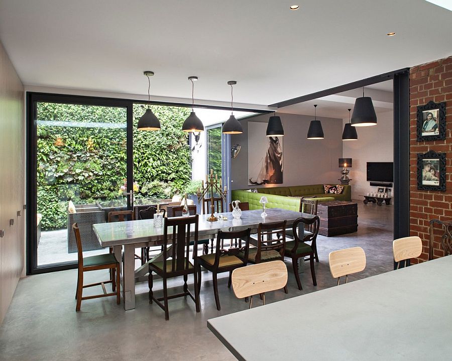 Exposed brick walls in the kitchen reflect the past of revamped home